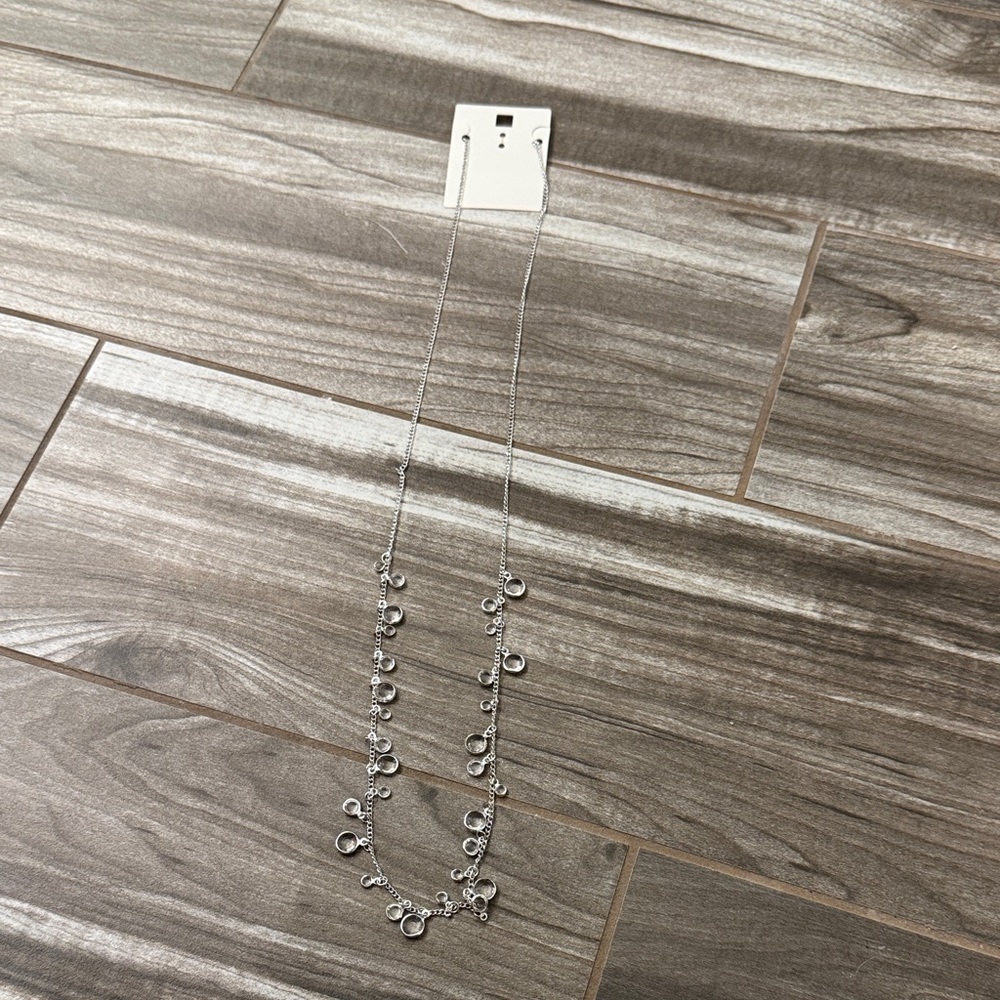 Elegant Silver Necklace with Charms